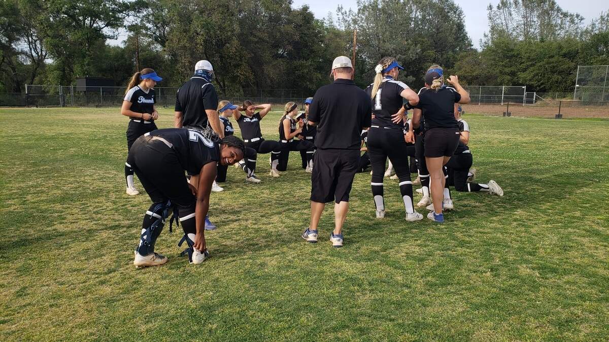 The Rocklin softball team huddles after beating Del Oro High School 6-3 on Friday, April 30, 2021.