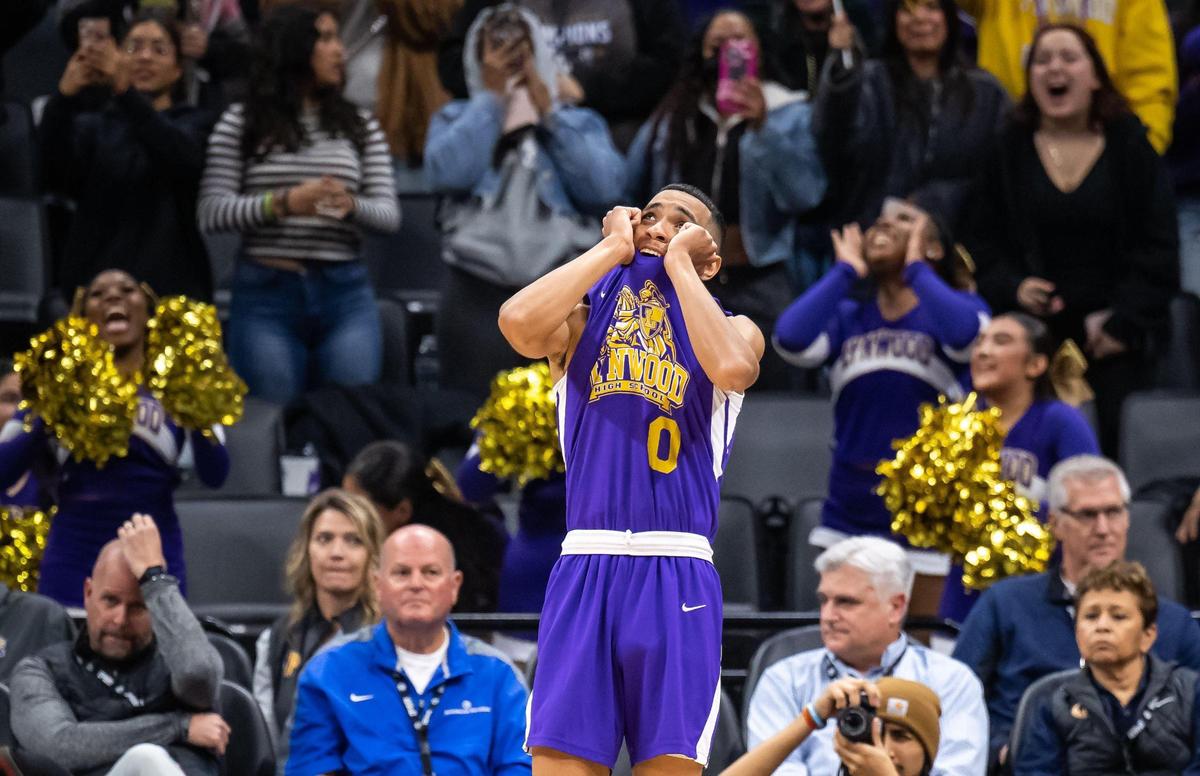 Lynwood Knights forward Devon Taylor (0) looks up at the score towards the end of there 89-58 win over the Sierra Chieftains in the CIF Division V high school boys basketball state final game Friday, March 10, 2023, at Golden 1 Center in Sacramento.