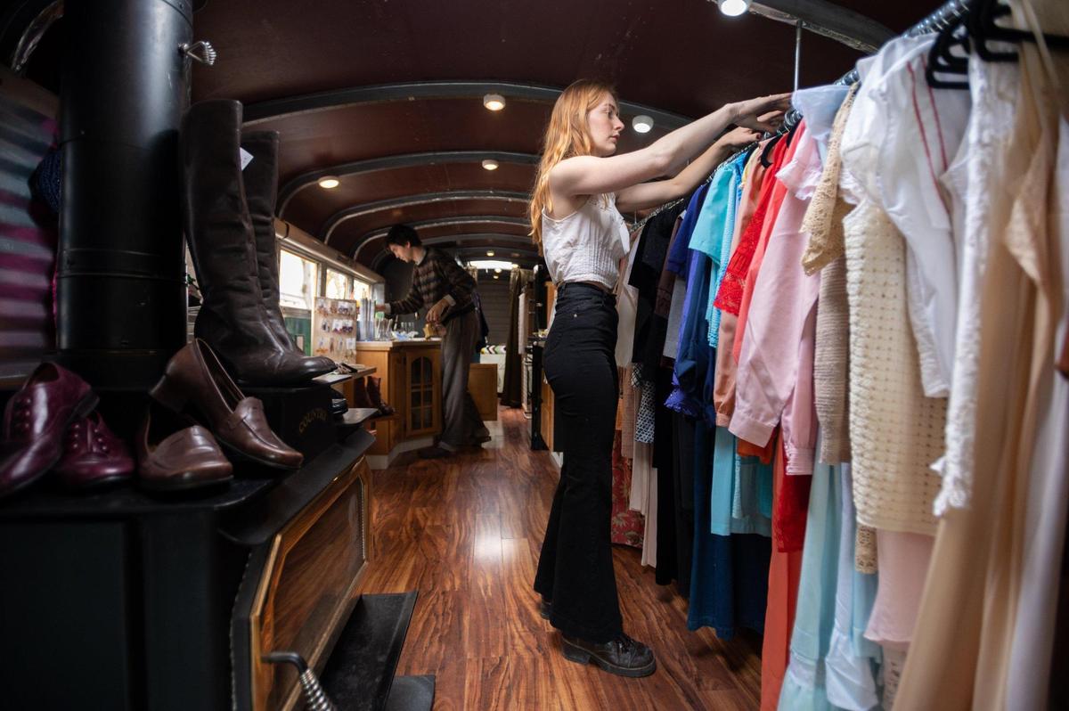 Audrey Panson, right, and Alina Lemon prepare their inventory March 4 for customers at The Bus Stop Vintage, a mobile shop that sells vintage items in Sacramento. Every Thursday, Friday and Sunday they set up in front of the MARRS building. On Saturdays, it is at the Midtown Farmer’s Market.
