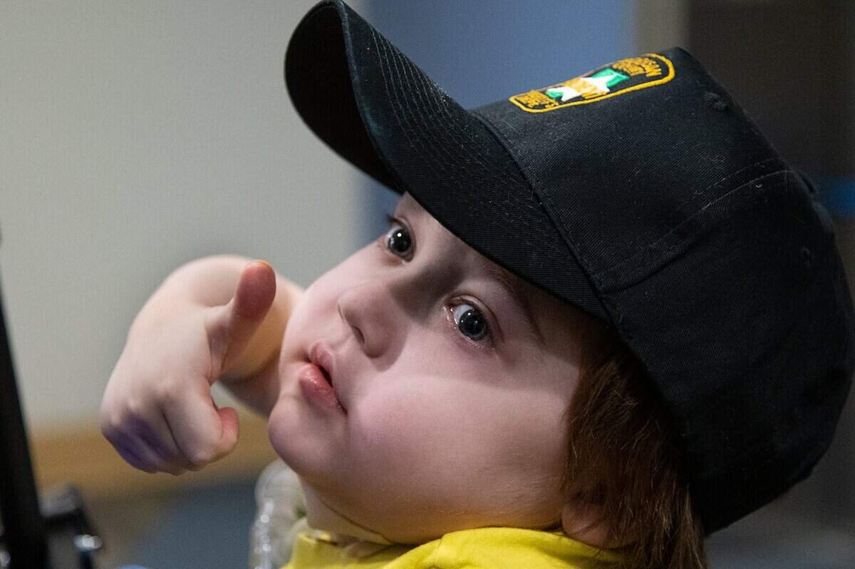 Noah Schneider, 5, give a thumbs up as he leaves the Sutter Medical Center with his parents Haley and Andrew Schneider of Yuba City on Monday. Noah, who was born with cystic fibrosis, spent two months in the hospital after getting COVID-19.