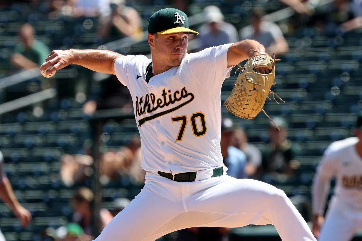 Athletics starting pitcher J.T. Ginn(70) throws a pitch against the Texas Rangers during the first inning at Sutter Health Park.
