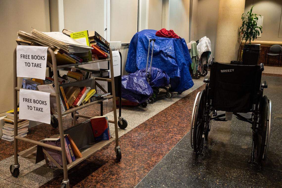 Homeless residents escape inclement winter weather for the night at the warming center at Tsakopoulos Library Galleria on Wednesday, Jan. 27, in downtown Sacramento.