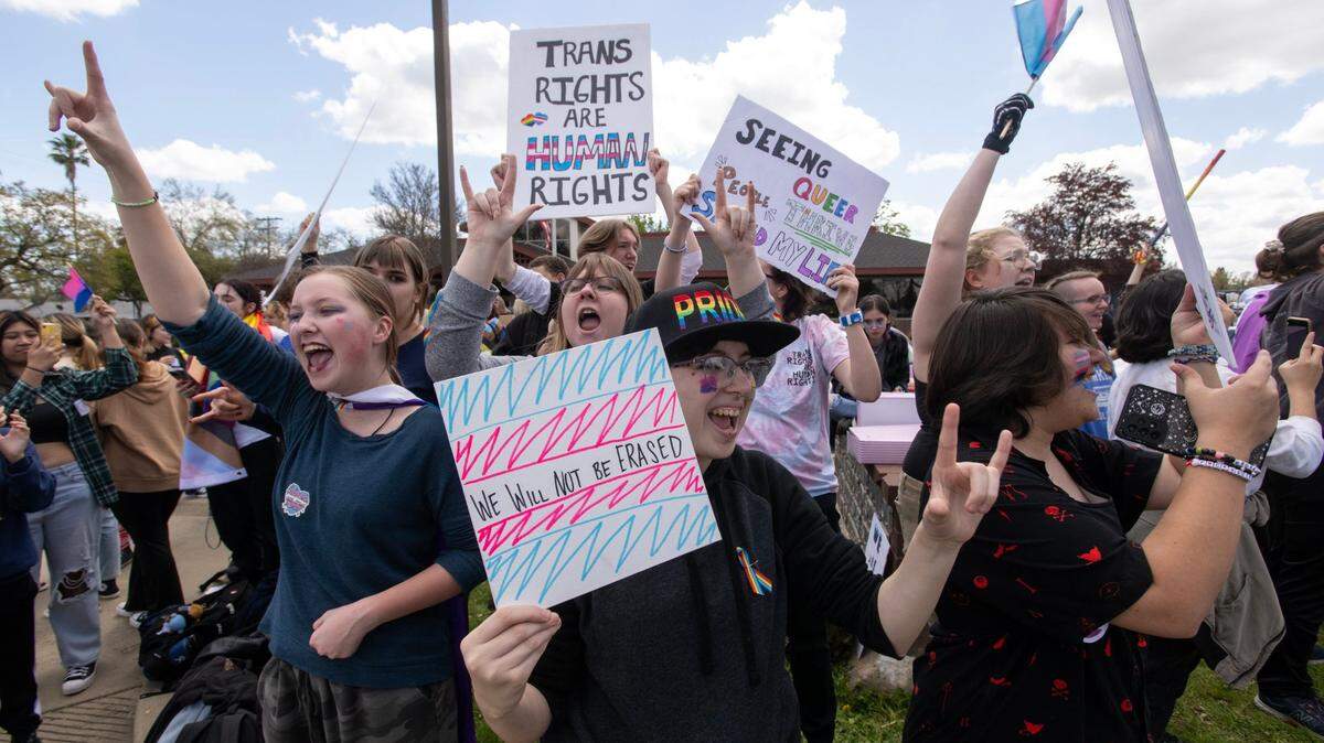 Oakmont High School students Jeane Nelson and Alexis Garber show their support during a school walkout in Roseville in March to protest the Roseville Joint Union High School District’s decision to cut ties with a local LGBTQ group.