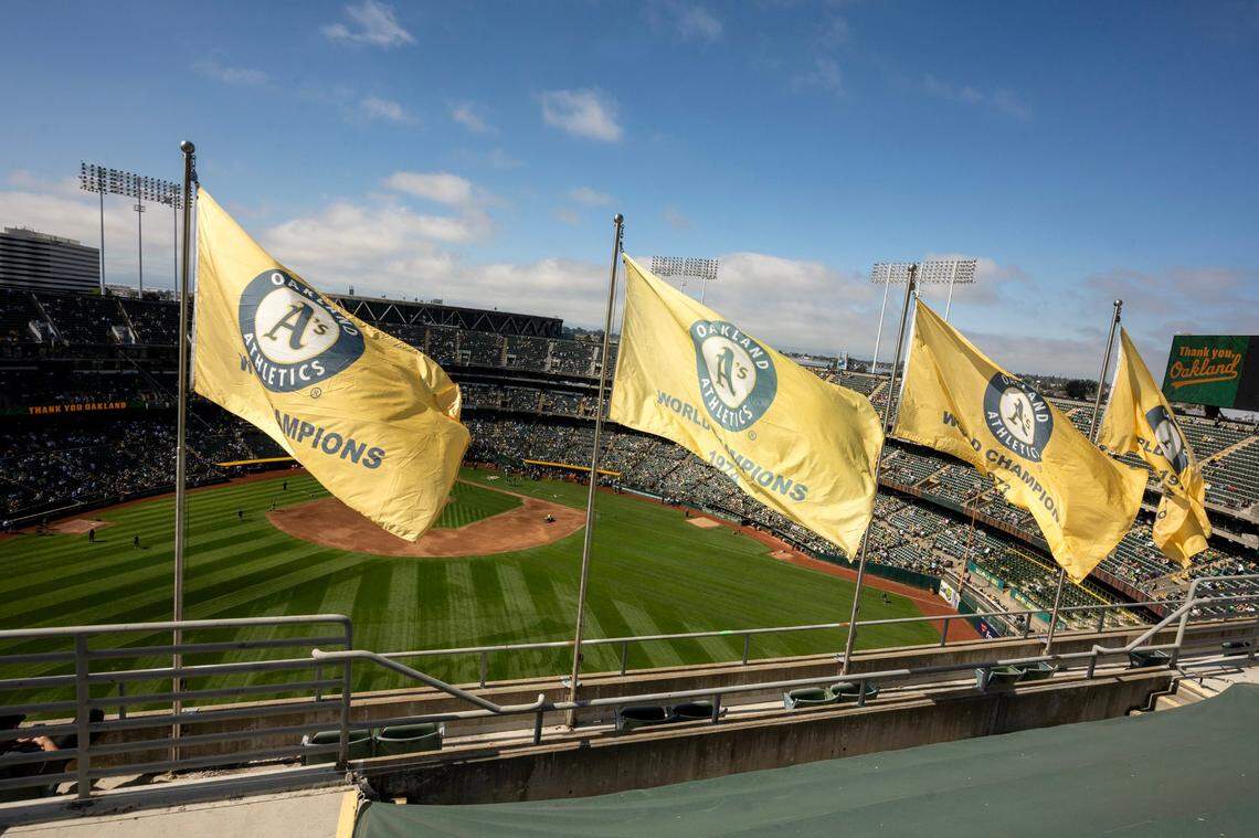 World Series flags wave from the upper deck in centerfield known as Mt. Davis before the Athletics played their final game at Oakland-Alameda County Coliseum on Thursday.