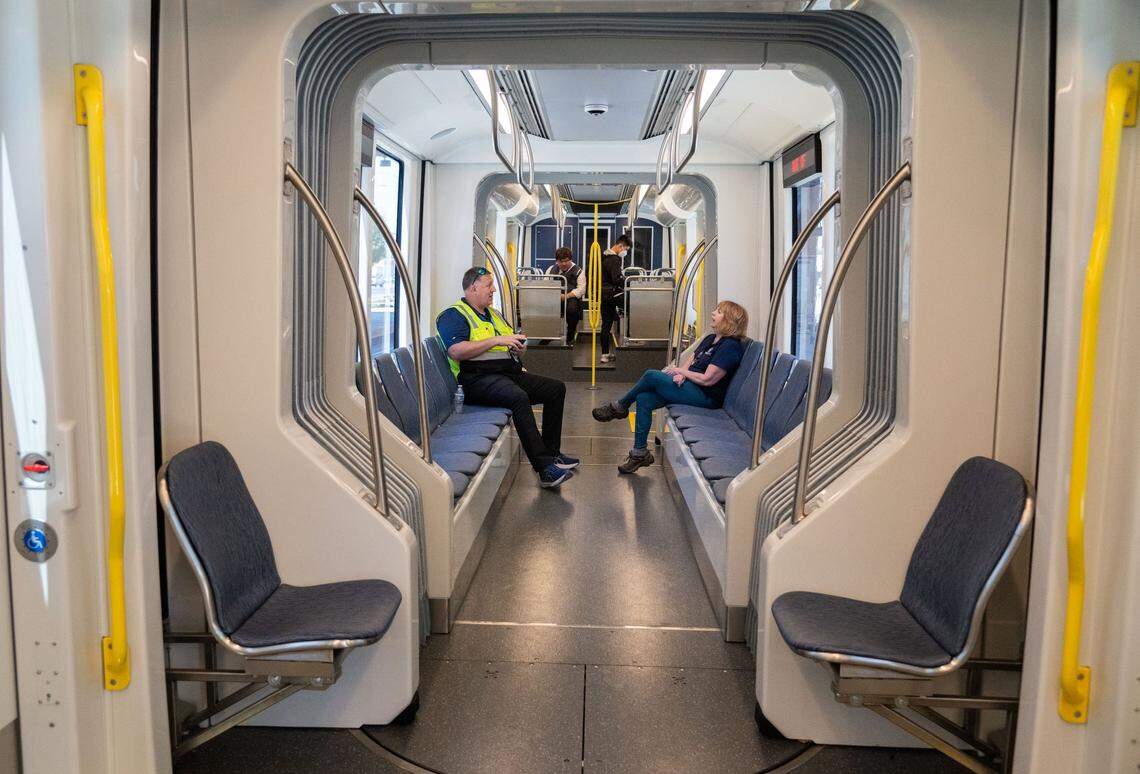 Sacramento Regional Transit workers and members of the public sit inside the air conditioned S700 low-floor light rail train at the Township 9 station in Sacramento on Wednesday. “Our customer service line is always a great resource for riders or anyone interested in riding,” said RT spokesperson Jessica Gonzalez.