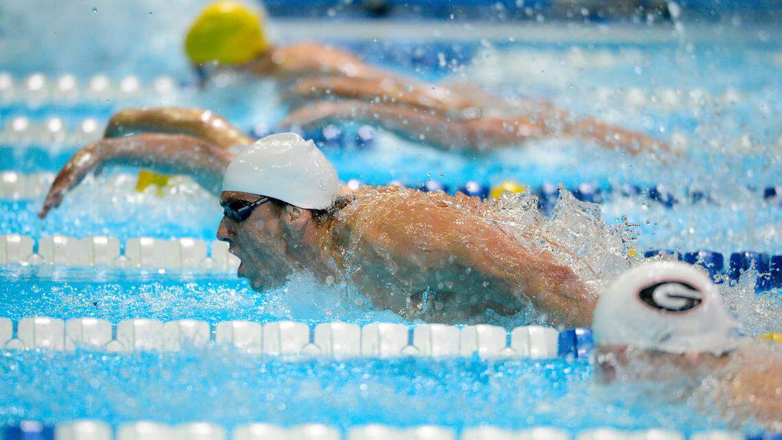 Michael Phelps swims in the men’s 200-meter butterfly preliminaries at the U.S. Olympic swimming trials, Wednesday, June 27, 2012, in Omaha, Neb. A 16-year-old swimmer in Colorado was disqualified from a high school state championship swim relay on June 25, 2021, for wearing a glucose monitor without a doctor’s note. The teen needs it to track his diabetes.