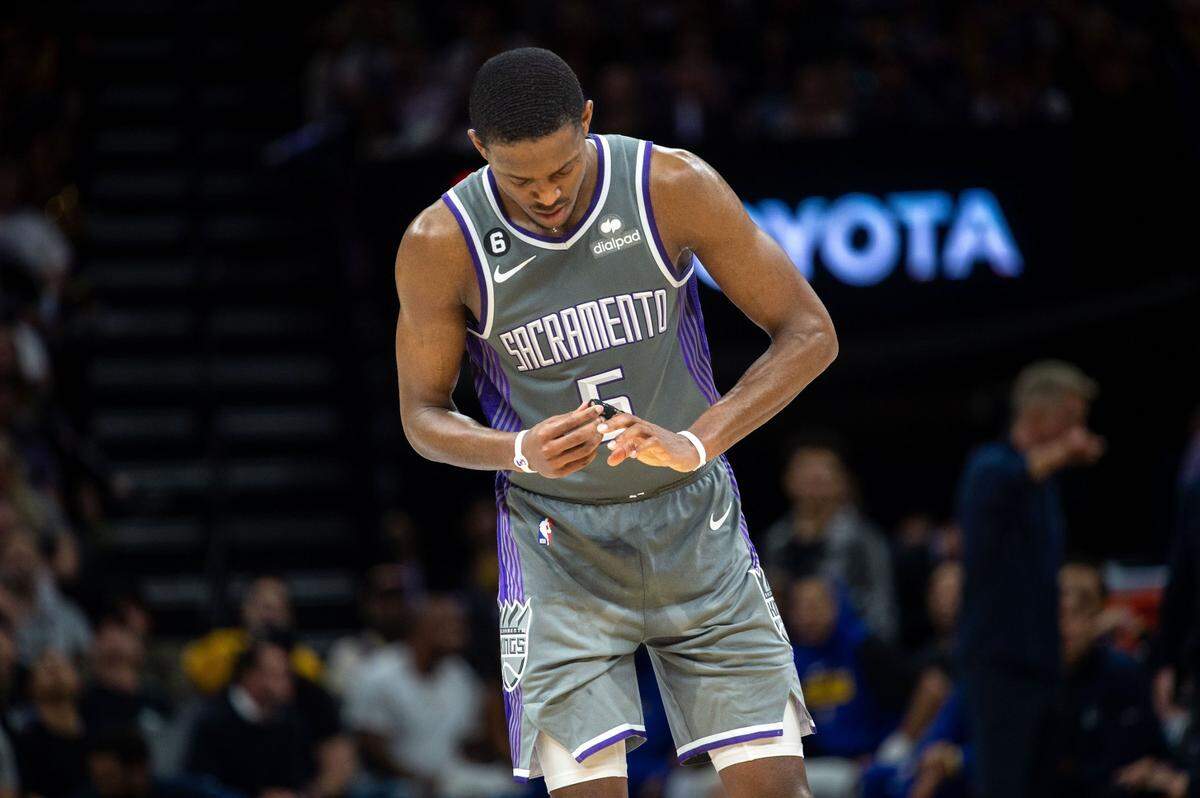 Sacramento Kings guard De’Aaron Fox (5) checks on his injured finger during Game 5 of the first-round NBA playoff series at Golden 1 Center on Wednesday, April 26, 2023.
