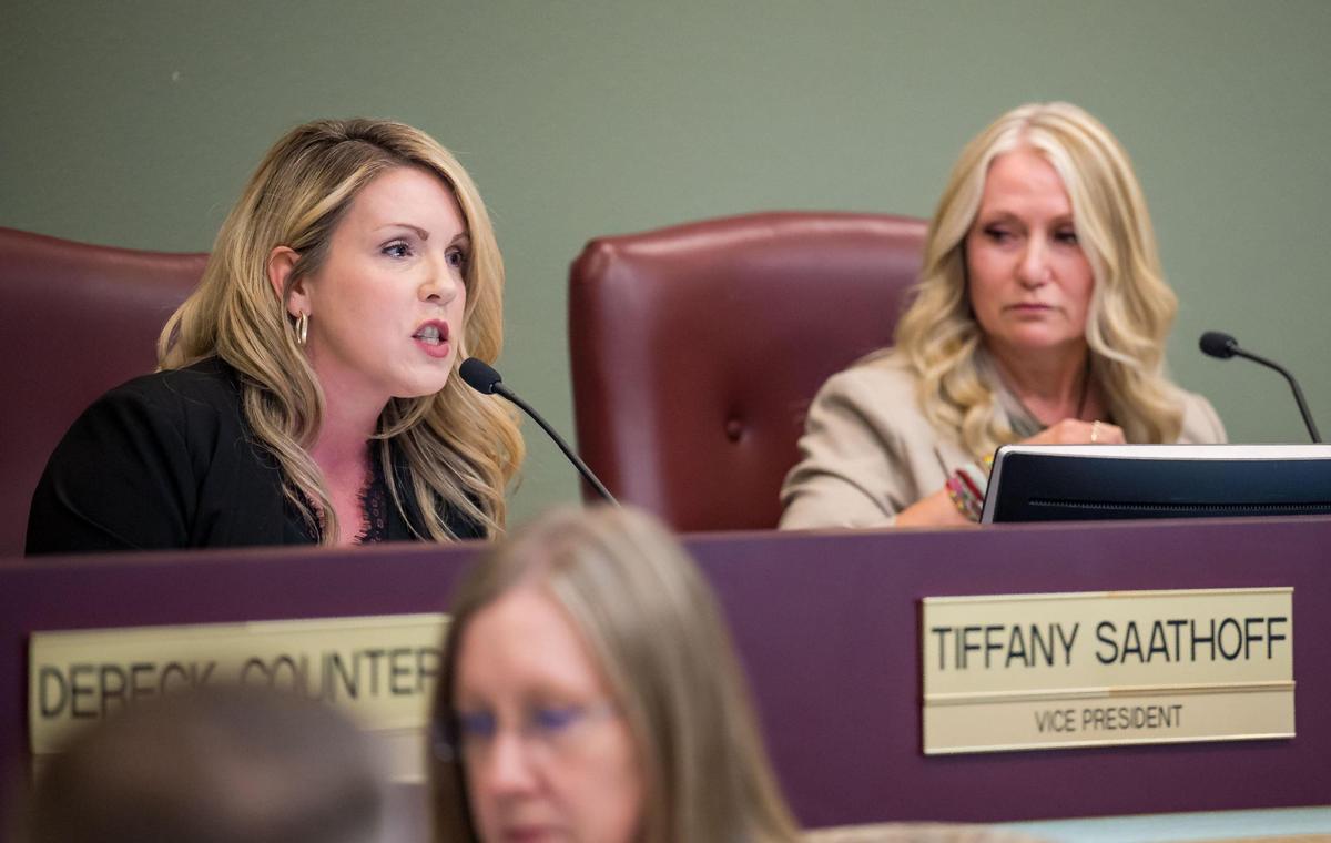 Rocklin Unified School District Board Member Tiffany Saathoff, left, speaks during a board meeting Wednesday in support of a policy requiring schools to possibly violate state law by “outing” transgender students to their parents.