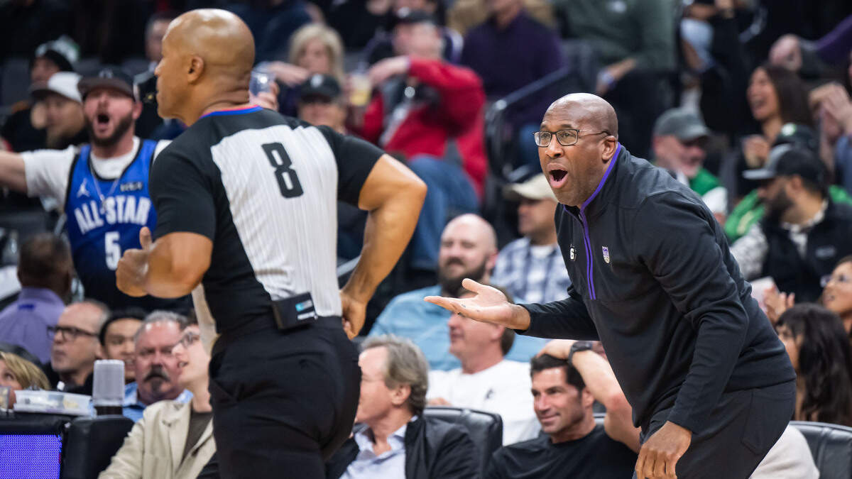 Sacramento Kings head coach Mike Brown and fans react to no foul call against the Boston Celtics in the first half of the NBA basketball game Tuesday, March 21, 2023, at Golden 1 Center.