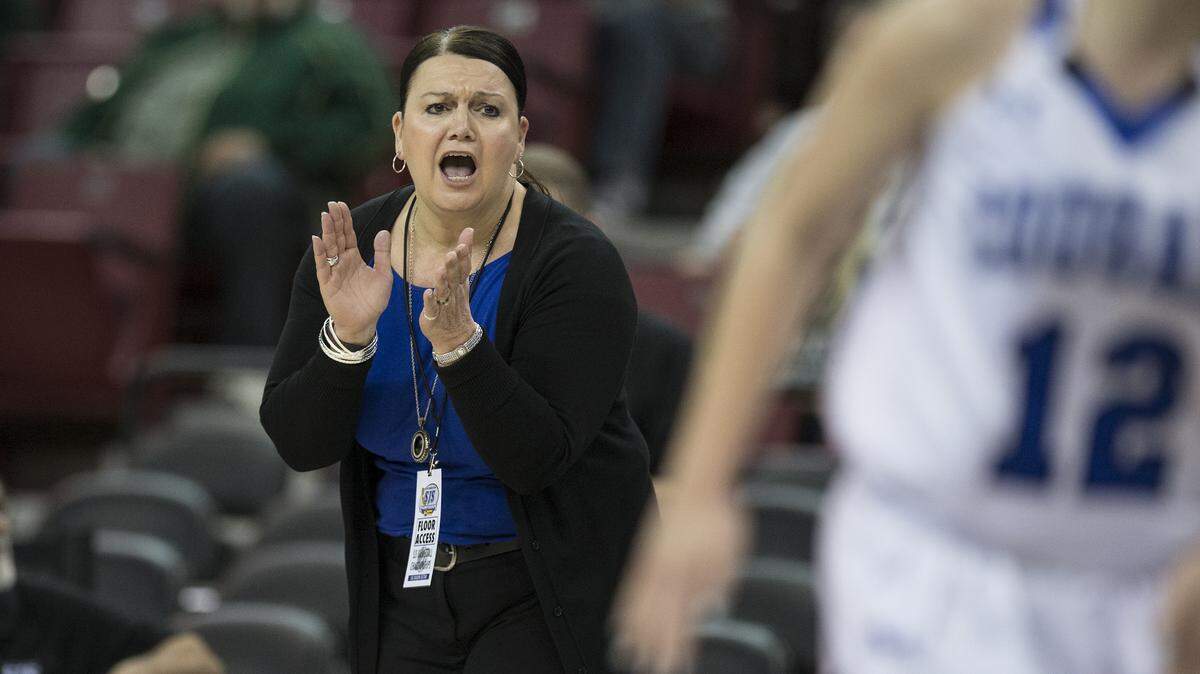 Capital Christian coach Suzanne Baker cheers for her team in the girls Sac-Joaquin Section Division V playoff game against Argonaut at Sleep Train Arena in Sacramento on March 4, 2016.