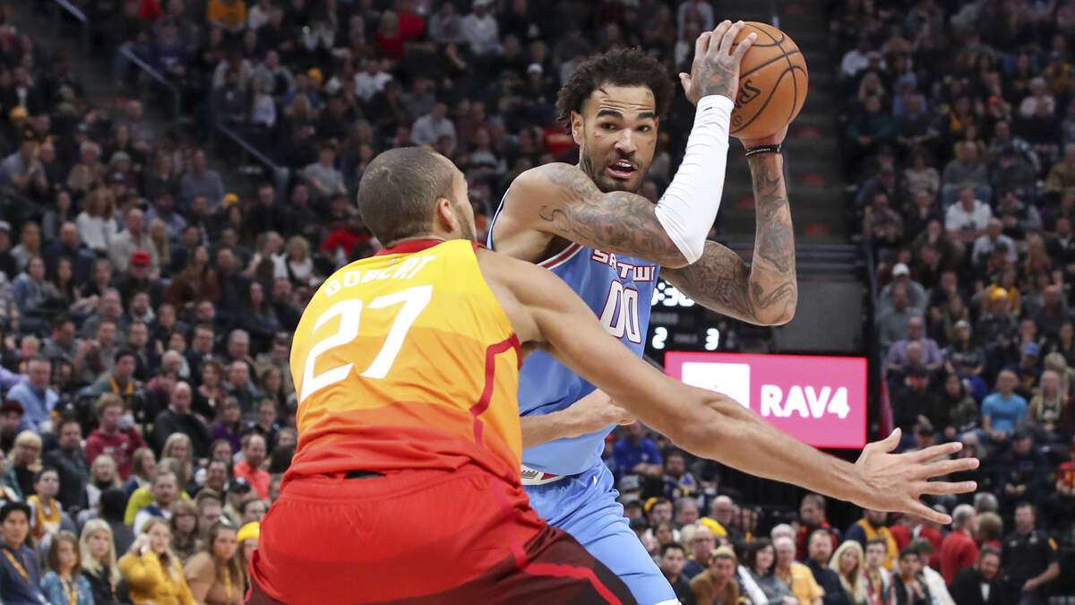 Kings center Willie Cauley-Stein protects the ball from Utah Jazz center Rudy Gobert (27) on Wednesday in Salt Lake City. Cauley-Stein led the Kings with 23 points in a 119-110 victory.