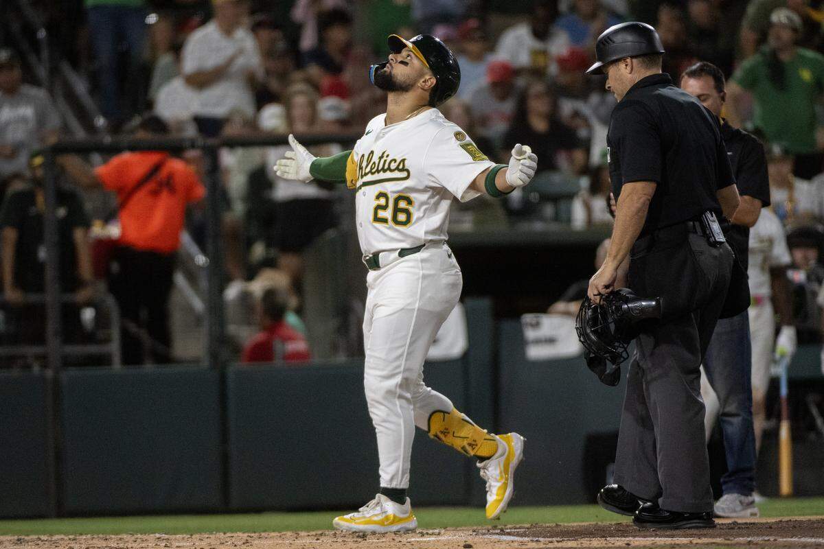 Athletics outfielder Carlos Cortes crosses the plate after his two-run home run In the second inning during a game at Sutter Health Park on Saturday in West Sacramento.