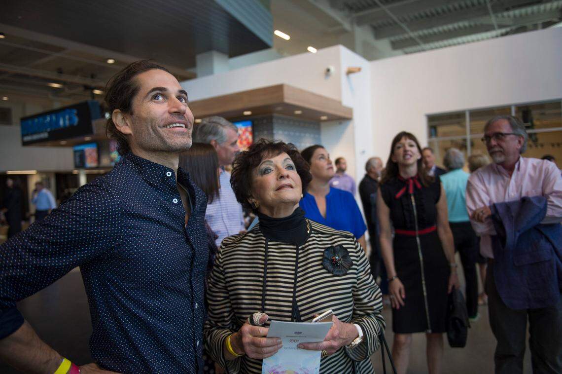 Sacramento artist Bryan Valenzuela watches with arena art selection panelist Marcy Friedman in 2016 as his art piece, “Multitudes Converge” is installed at the Golden 1 Center. Valenzuela received CARES Act funds.