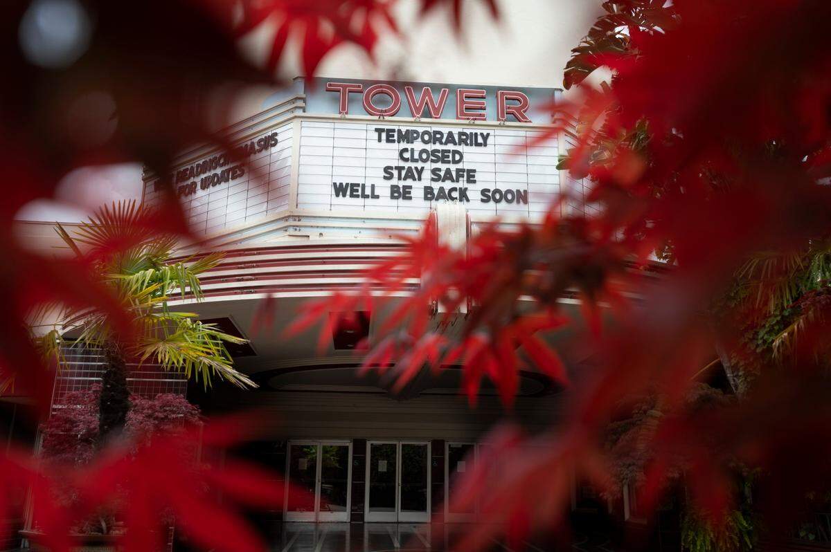 The Tower Theater marquee indicates it is temporarily closed during the coronavirus outbreak on a rainy Tuesday afternoon, March 24, 2020, in Sacramento.