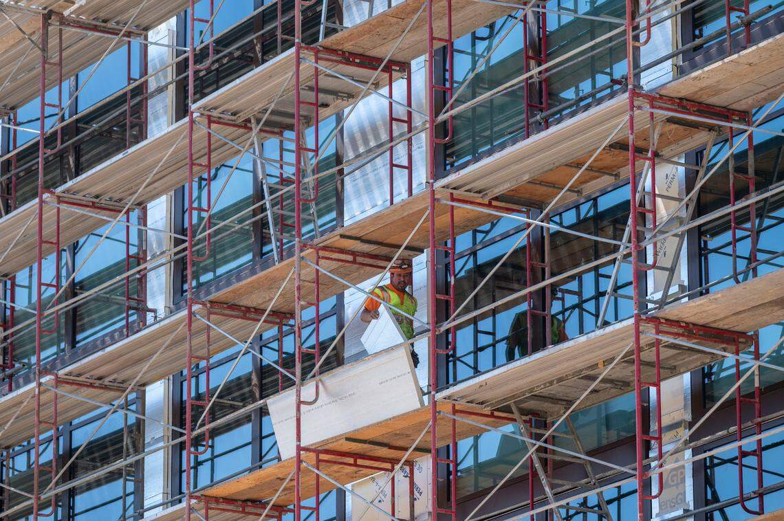 A worker walks on scaffolding Friday at Red Hawk Casino in El Dorado County as construction for a 150-room hotel is under way.