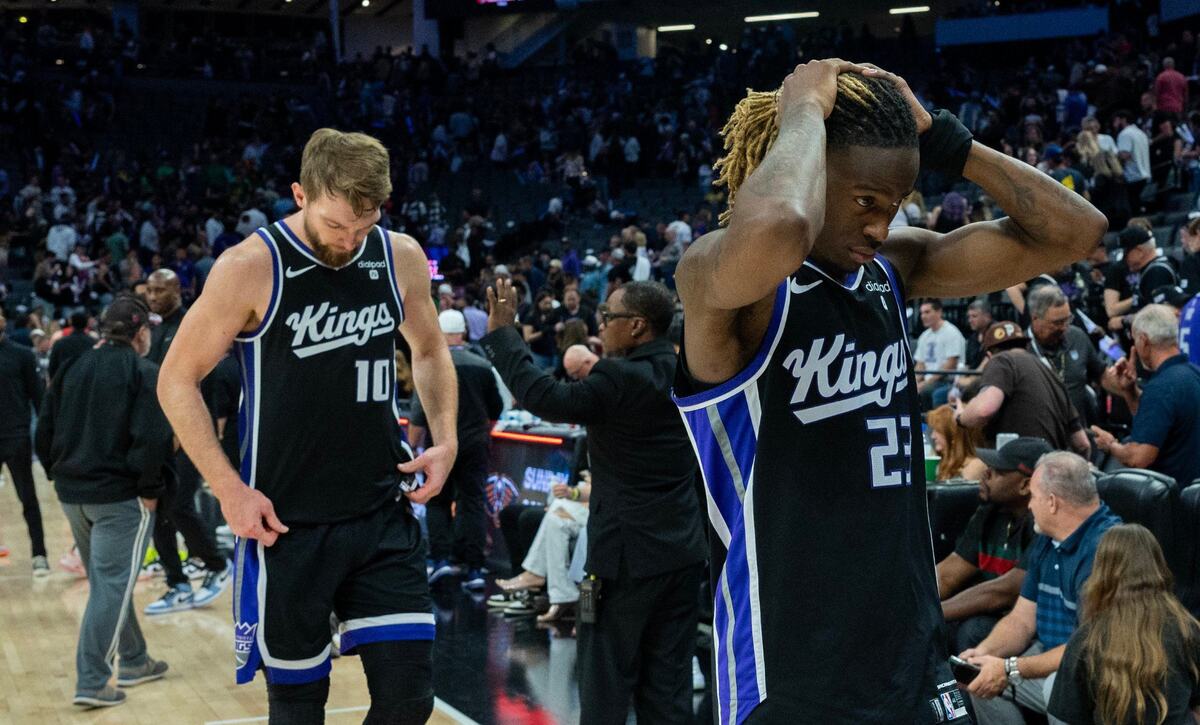 Sacramento Kings guard Keon Ellis (23) and center Domantas Sabonis (10) walk off the court after a 135-123 loss to the New Orleans Pelicans on Thursday at Golden 1 Center in Sacramento.