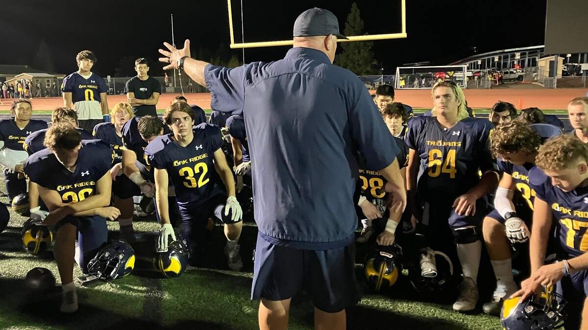 Oak Ridge football coach Casey Taylor addresses his team after the Trojans moved to 4-0 on Thursday, Sept. 15, 2022.