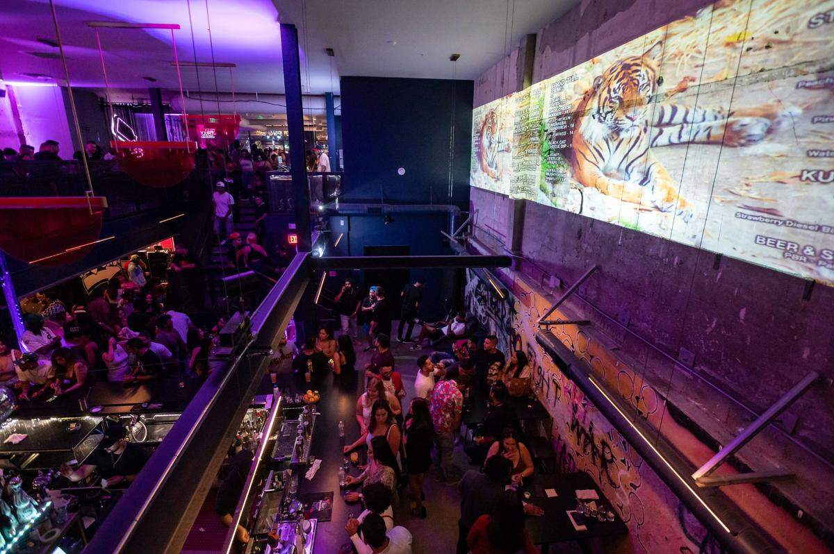 People drink, dance and socialize at Tiger Restaurant & Lounge in 2021.