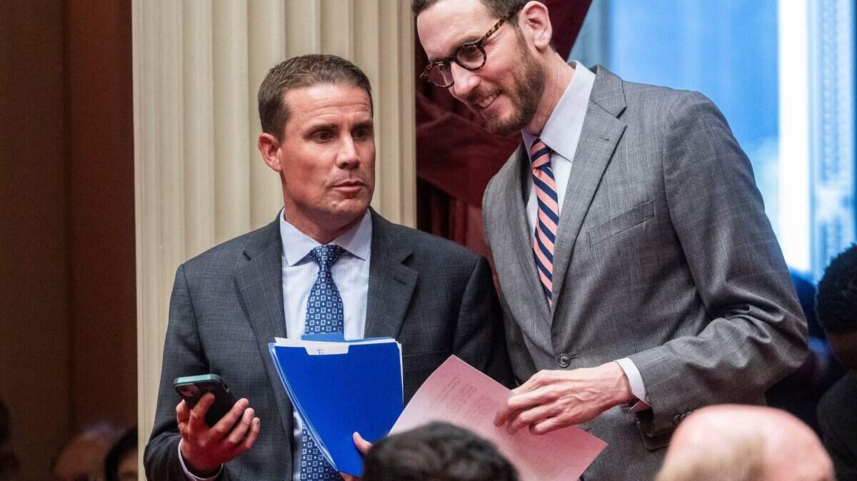 Senate President Pro Tem Mike McGuire speaks with Sen. Scott Wiener, D-San Francisco, during a Senate session on Monday, June 9, 2025.