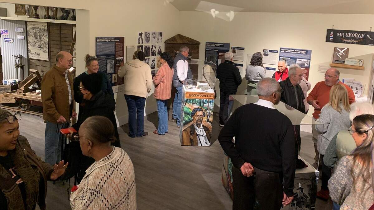 Visitors walk through the exhibit From Barbers’ Row to Beale Air Force Base: Black History in Yuba-Sutter at the Sutter County Museum in Yuba City. The exhibit received an Award of Excellence from the American Association for State and Local History and highlights the history of Black communities in Sutter and Yuba counties.