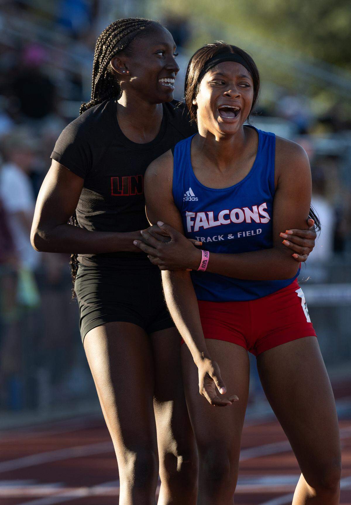 Keilee Hall of Christian Brothers, right, won the 300 meter girls hurdles with a time of 42.02, holding off Yvette Harris of Lincoln of Stockton (42.74), left, in the CIF Sac-Joaquin Section Masters track finals at Davis High School in Davis, Calif., Saturday, May 20, 2023.