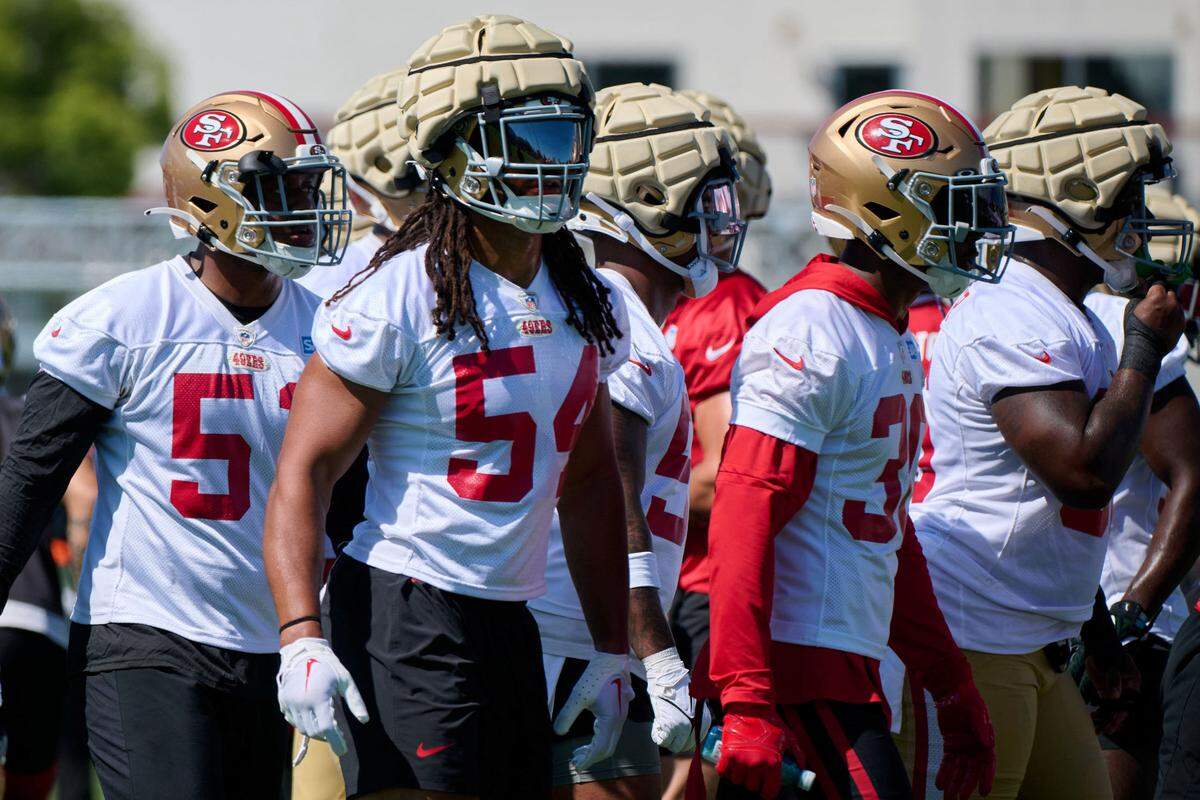 San Francisco 49ers linebacker Fred Warner (54) wears a Guardian Cap during drills with other players during training camp at the SAP Performance Facility on July 27, 2023.