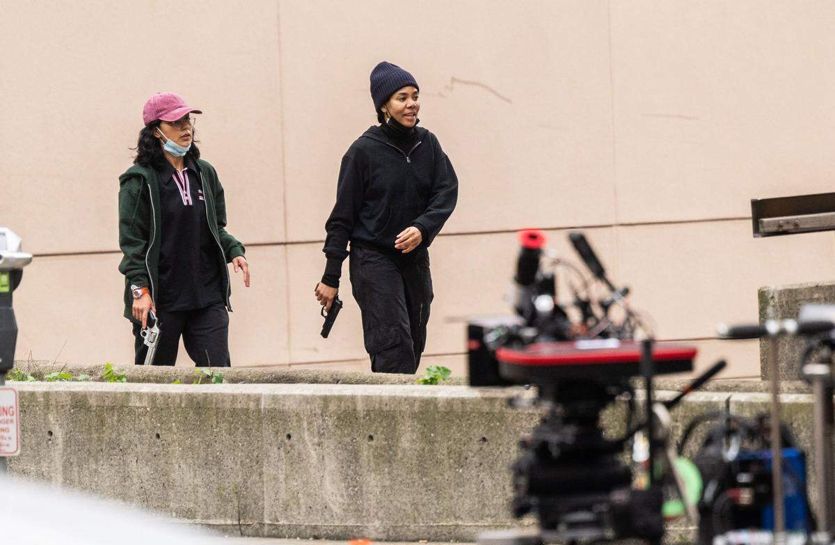 Actors take part in the production of a Warner Bros. Studios on Tuesday, Feb. 6, 2024 in Sacramento. The scene recorded included actors running with weapons on 6th Street between I and J Streets.