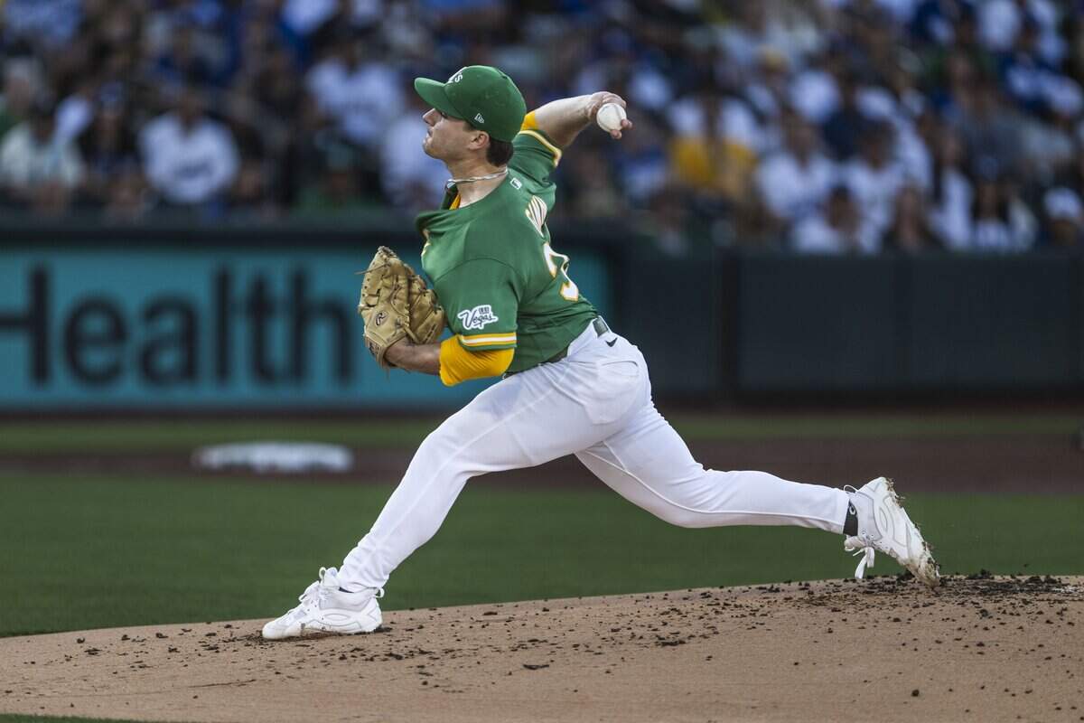 Athletics pitcher J.T. Ginn throw a pitch in the first inning of a game against the Los Angeles Dodgers at Sutter Health Park in West Sacramento on Wednesday.