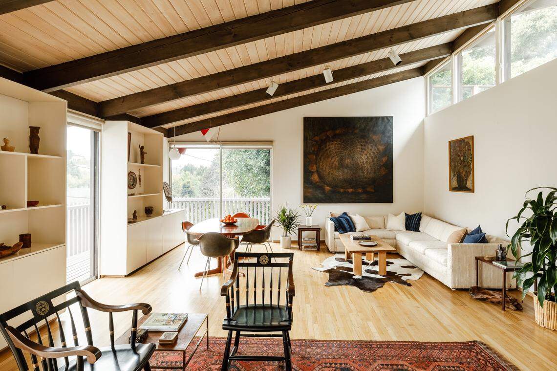 The home incorporates period features like cedar-shake siding, post-and-beam construction, soaring vaulted ceilings and luminous clerestory windows.