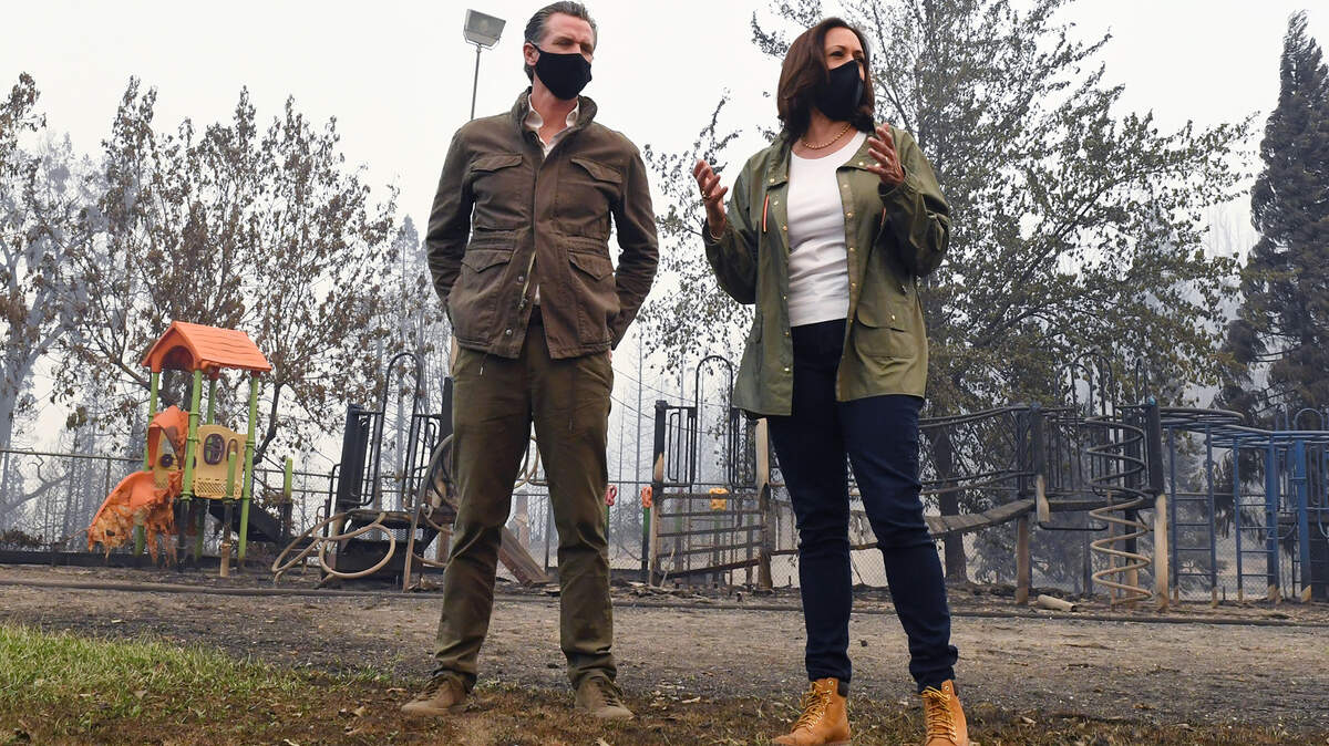 Then-Sen. Kamala Harris spoke with Gov. Gavin Newsom on Tuesday, Sept. 15, 2020, in front of melted playground equipment at Pine Ridge Elemetary School, burned by the Creek Fire, in the eastern Fresno County community of Auberry.