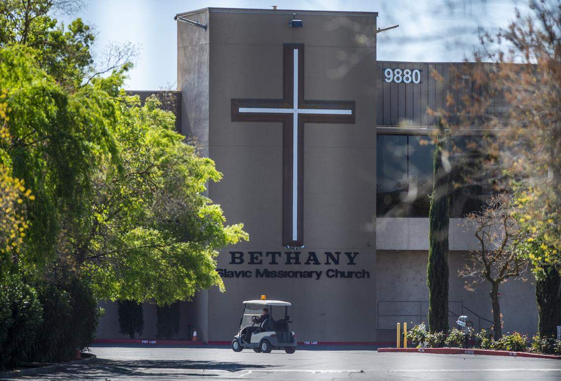 A man in a golf cart drives past Bethany Slavic Missionary Church in Sacramento County on Thursday, April 2, 2020. More than 70 members of the Bethany Slavic Missionary Church near Sacramento CA are infected with the coronavirus.
