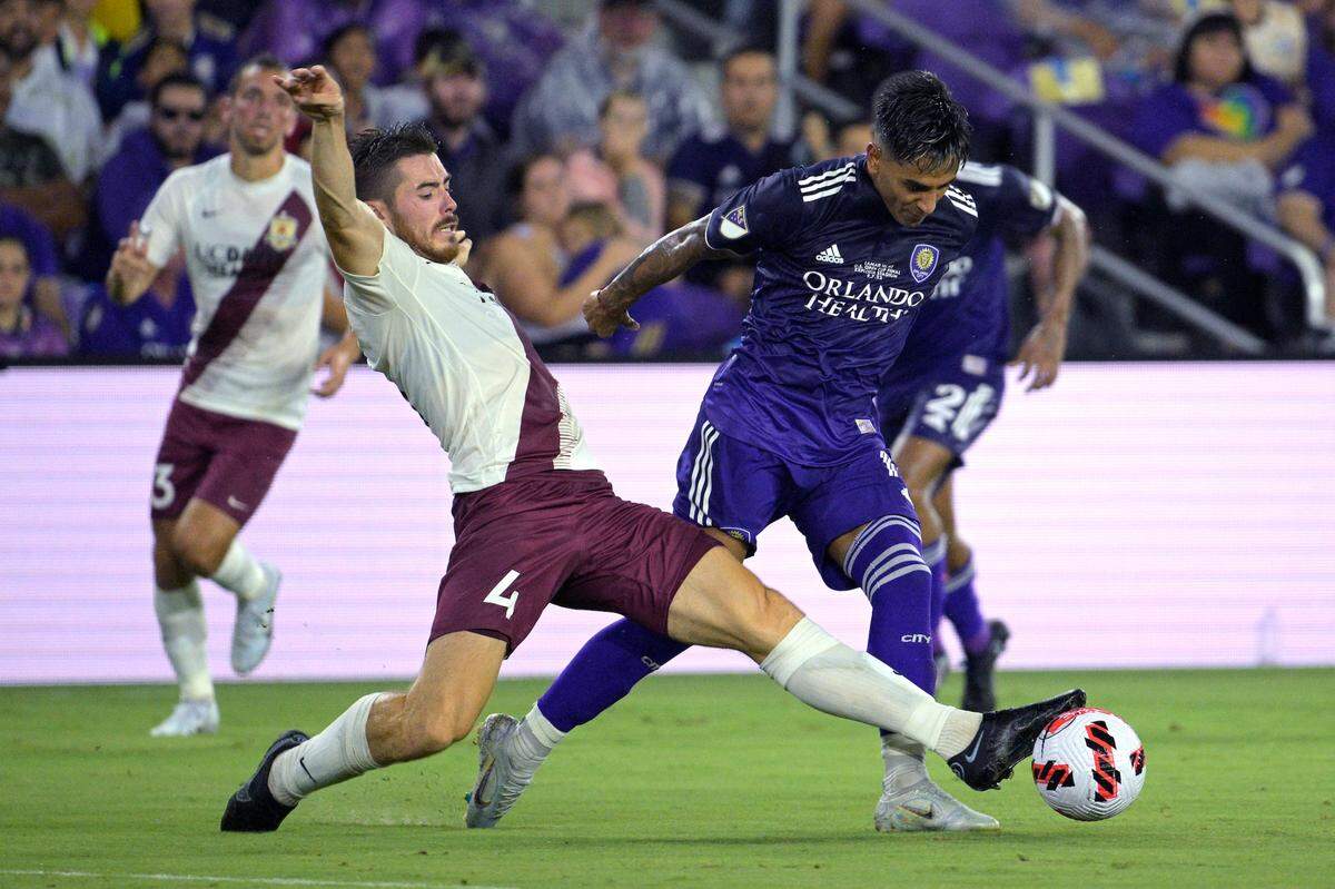Sacramento Republic FC’s Lee Desmond (4) defends against Orlando City’s Facundo Torres during the first half of a U.S. Open Cup Final soccer match, Wednesday, July 27, 2022, in Orlando, Fla.