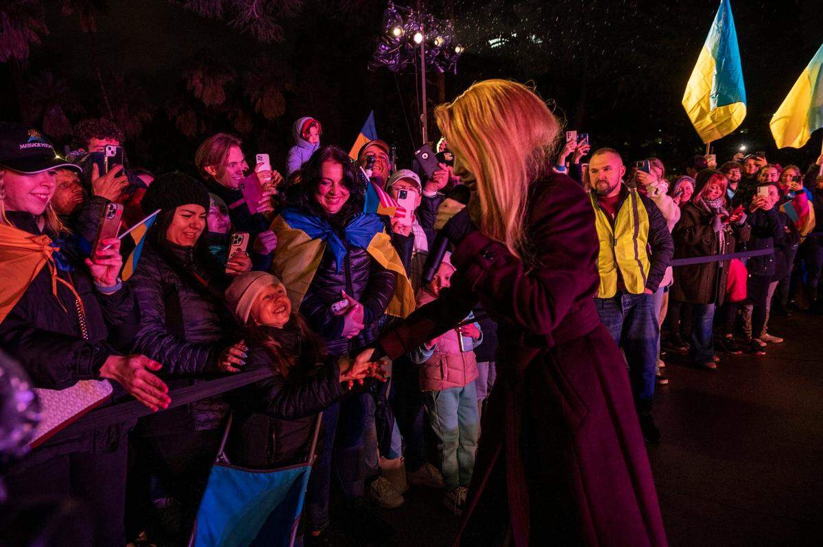 Ukrainian singer Tina Karol shakes hands with a girl in the crowd as she sings during a rally at the California Capitol on Friday. She has been traveling the world to bring attention to her country’s battle against Russian’s aggression.