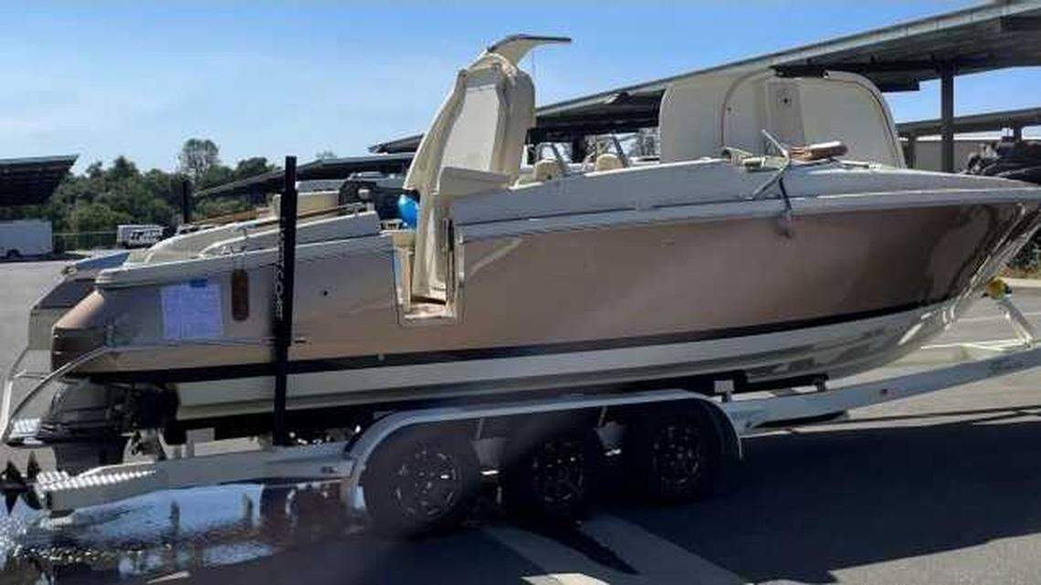 The Chris-Craft Launch-28 GT that capsized June 21 near D.L. Bliss State Park is shown after its recovery from Lake Tahoe. Investigators found no signs of hull damage in the accident that killed 8 boaters. Federal investigators said only one of the 10 boaters, who survived with her daughter, was wearing a life jacket.