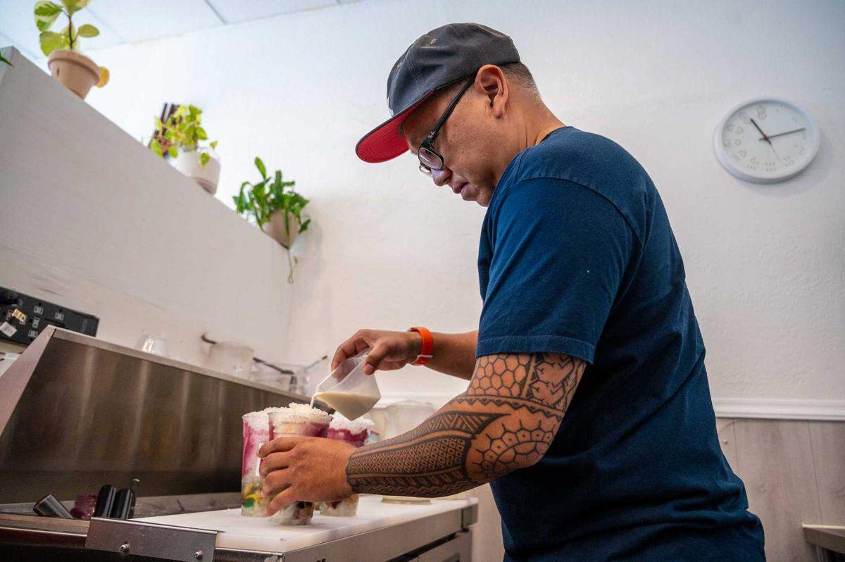 Co-owner Ray Suavillo makes halo-halo at Spoon and Fork in Sacramento on Thursday.