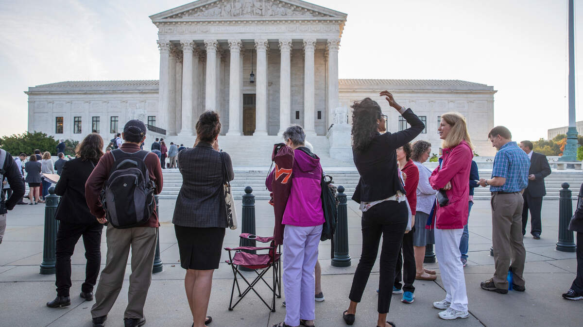 People line up at the U.S. Supreme Court on Monday, the first day of its new term. Amid the political chaos of Judge Brett Kavanaugh’s nomination, the high court’s work begins with only eight justices on the bench, four conservatives and four liberals.