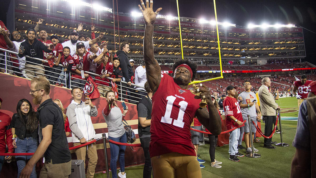 San Francisco 49ers wide receiver Marquise Goodwin (11) throws part of his uniform to fans after the 49ers beat the Cleveland Browns at Levi’s Stadium on Monday, October 7, 2019 in Santa Clara, Calif.