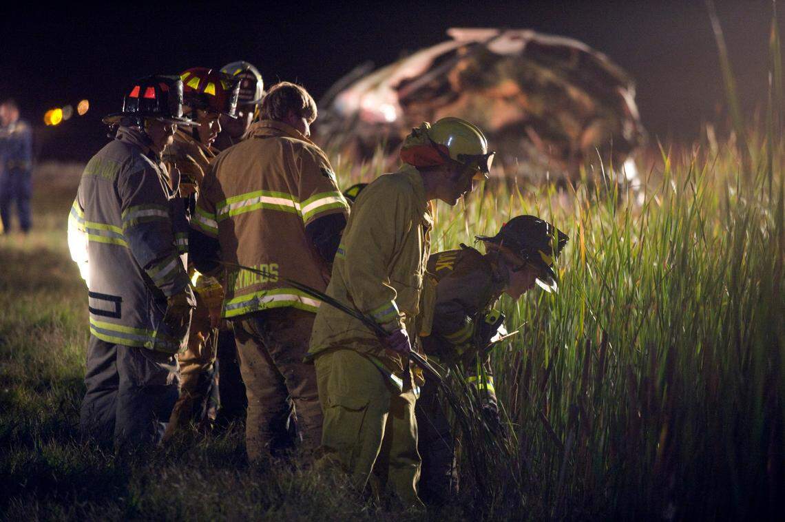 Emergency crews search for survivors after the bus Quinton Watts was driving crashed on Oct. 5, 2008, on its way to the Colusa Casino Resort.