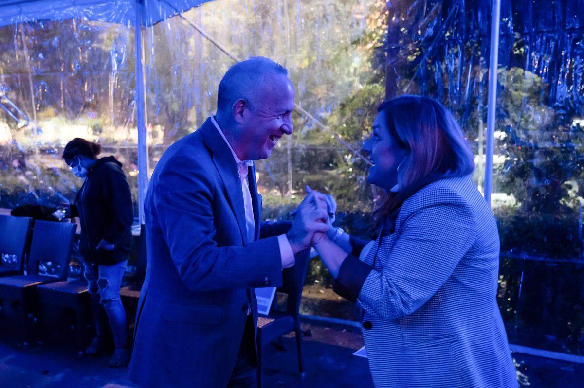 Sacramento Mayor Darrell Steinberg celebrates early results with Angelique Ashby at her state Senate election night party at Bella Bru Cafe in Natomas on Tuesday, Nov. 8, 2022.