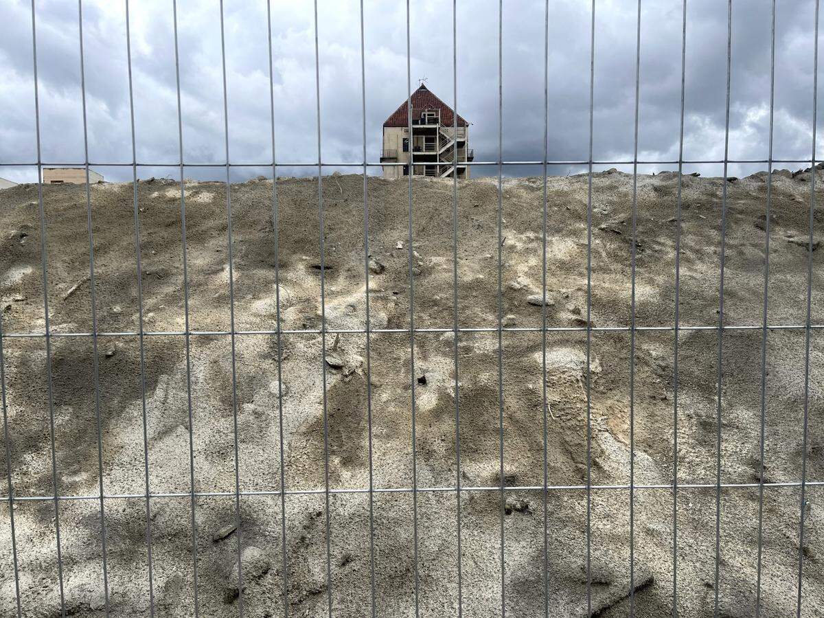 A pile of rubble more than 10 feet tall sits Thursday  where Hotel Marysville once stood at the corner of E Street and Fifth Street in Marysville. It’s unclear when the city of Marysville will be able to clear out the pile from downtown.