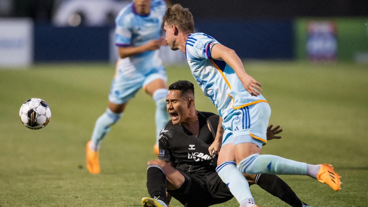 Sacramento Republic FC forward Sebastian Herrera (9) goes down on a foul by Colorado Rapids defender Andreas Maxsø (5) in scoring position during the first half of the U.S. Open Cup Round of 32 soccer match Tuesday, May 9, 2023, at Heart Health Park in Sacramento.