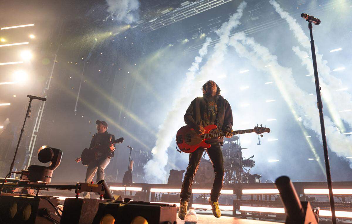 Fall Out Boy guitarist and vocalist Patrick Stump, left, and bassist Pete Wentz make pyrotechnic-filled entrance on Sunday at Golden 1 Center.