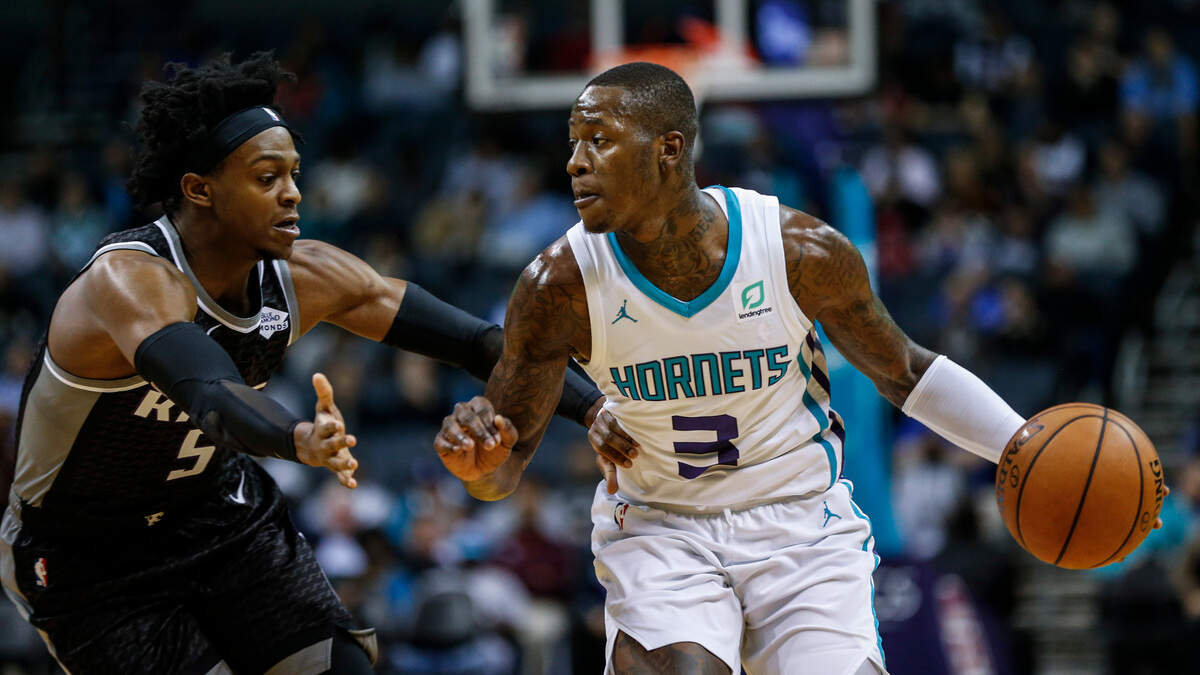 Charlotte guard Terry Rozier runs the offense as Kings guard De’Aaron Fox defends in his first game back from a sprained ankle.