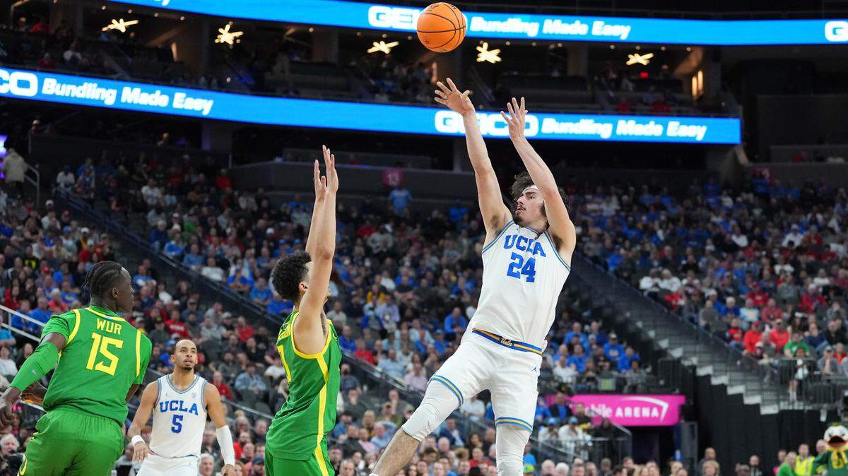 UCLA Bruins guard Jaime Jaquez Jr. (24) shoots over Oregon Ducks guard Will Richardson (0) during the second half on March 10, 2023, at T-Mobile Arena in Las Vegas, Nevada.