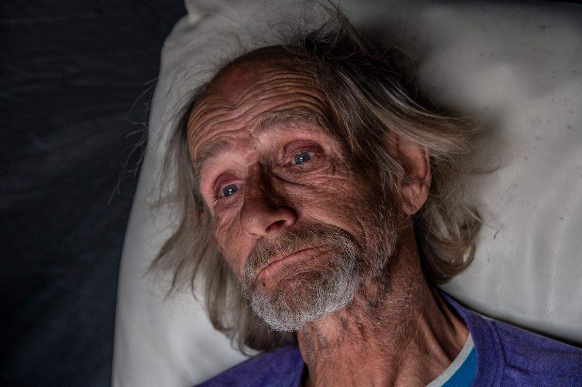 Tears fill the eyes of Roy Warren, 63, as he talks about being stuck homelessness because he lives on a fixed income and can’t afford rent on Jan. 21 in Auburn. “I was born and raised here and it’s not good,” he said. “It’s not good they way they treat us here.”