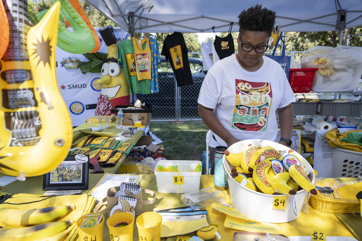 Daphne Burgess sells banana merchandise during the Sacramento Banana Festival at William Land Park on Sunday, Aug. 17, 2025.