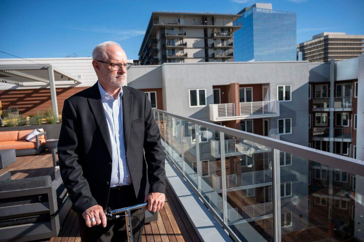 Brad Wuerer, a senior area director with Weidner Apartment Homes, stands on a rooftop deck on Thursday at the Capitol Towers apartment complex, a seven-story apartment building near Fifth and N streets that opened this fall with 218 units.