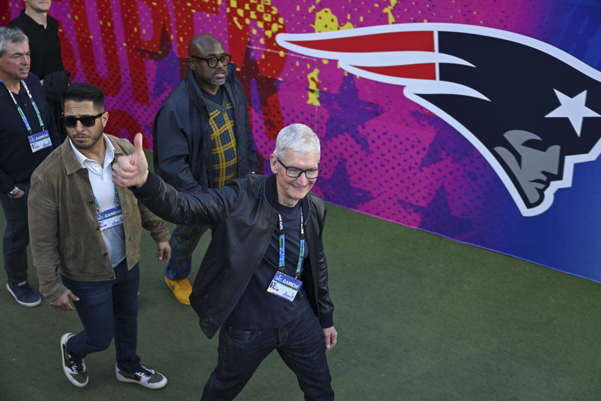 Apple CEO Tim Cook walks onto the field before the start of Super Bowl LX at Levi’s Stadium in Santa Clara on Sunday, Feb. 8, 2026.