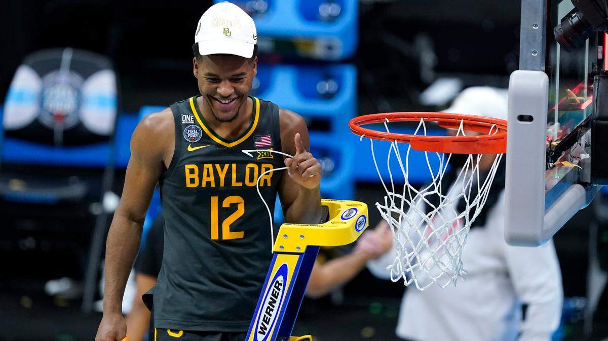 Baylor guard Jared Butler cuts down the net after the championship game against Gonzaga in the men’s Final Four NCAA college basketball tournament, Monday, April 5, 2021, at Lucas Oil Stadium in Indianapolis. Baylor won 86-70. (AP Photo/Darron Cummings)