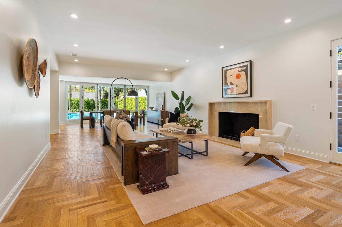 The main home features herringbone oak floors, a chef’s kitchen and a spa-like primary suite.